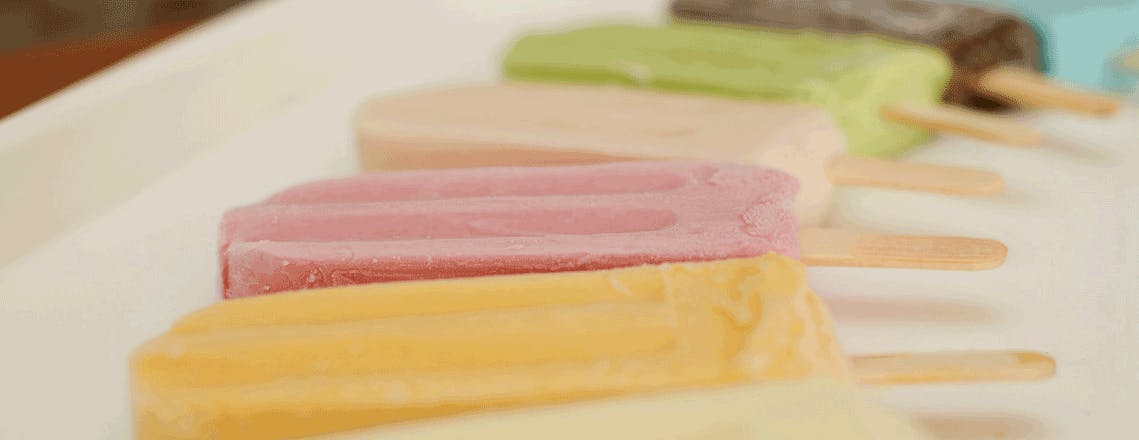 6 different flavors and colors of frozen fruit bars