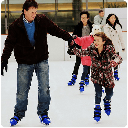 father and daughter ice skating with blue ice skates