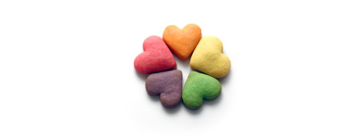 Five colored heart-shaped snacks