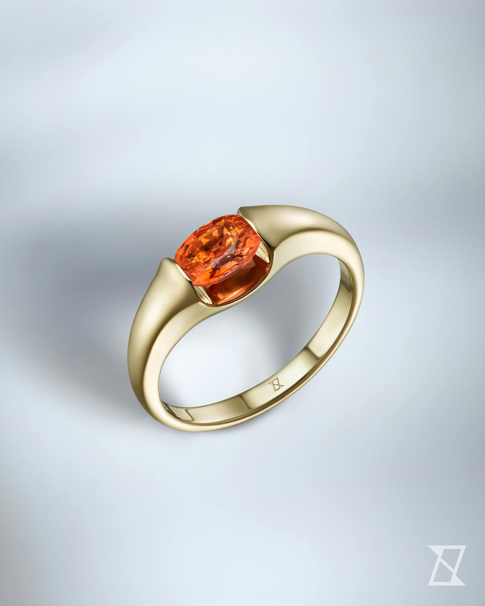 Engagement ring with an orange stone
