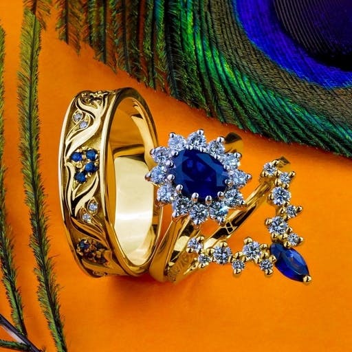 Yellow gold rings with sapphires and diamonds, matched to the ring.