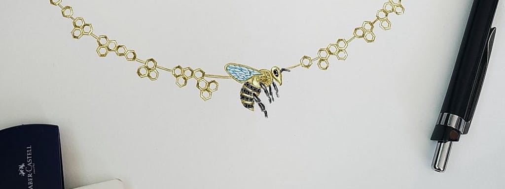 Necklace with a bee on a honeycomb