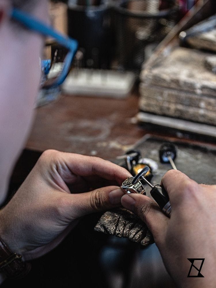 Polishing the tiger signet ring.