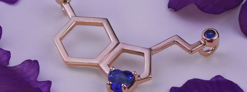 Serotonin molecule necklace with sapphires in rose gold