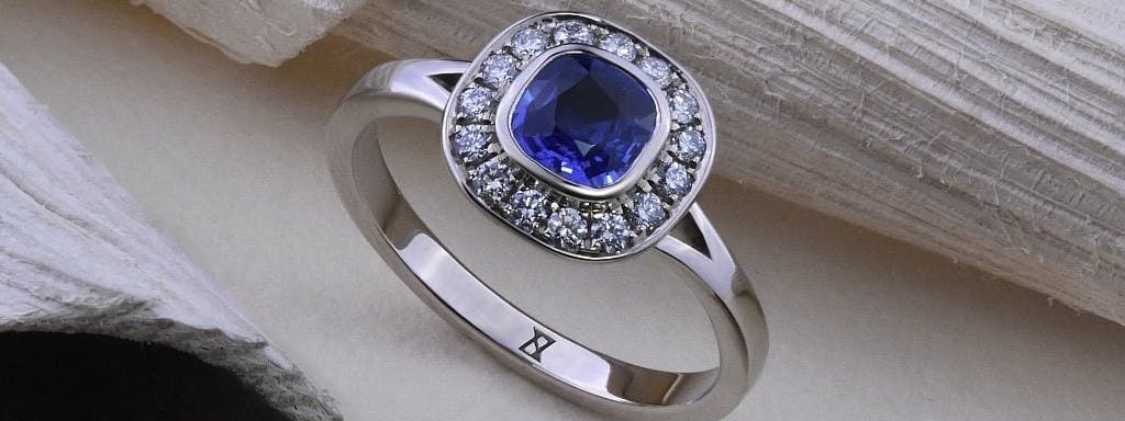 A cushion cut sapphire ring.