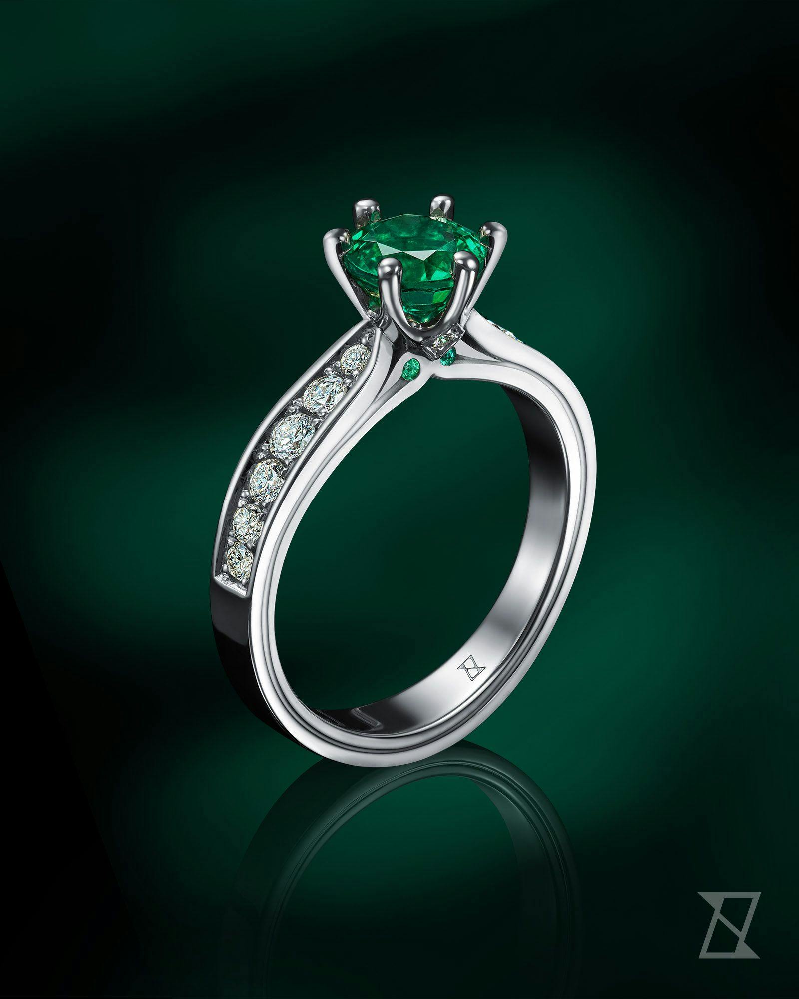 Doskonały szmaragd o najwyższej czystości dopełniony diamentami to doskonały przepis na indywidualny pierścionek zaręczynowy na zamówienie.