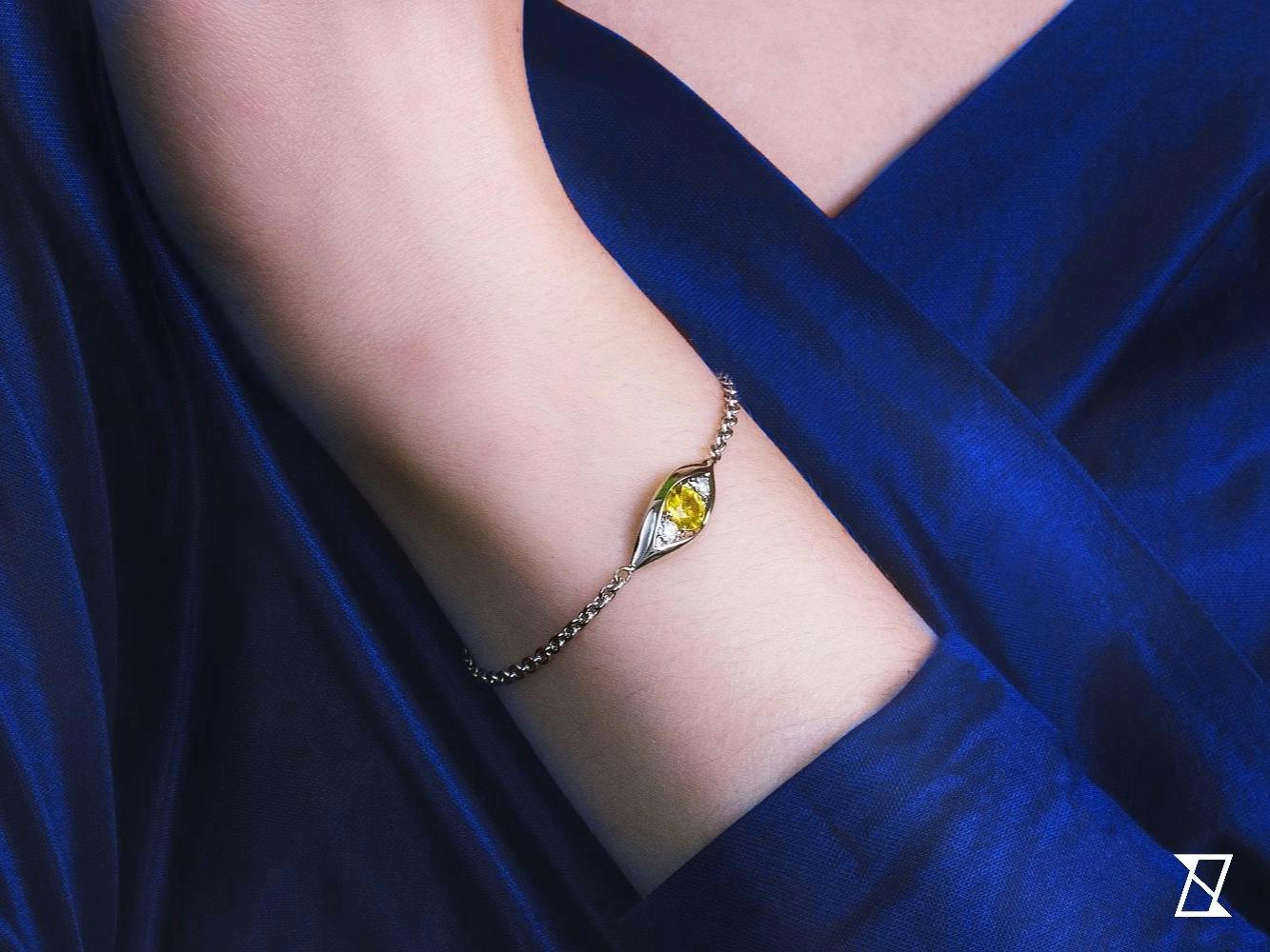 Yellow sapphire bracelet on a hand of a model.