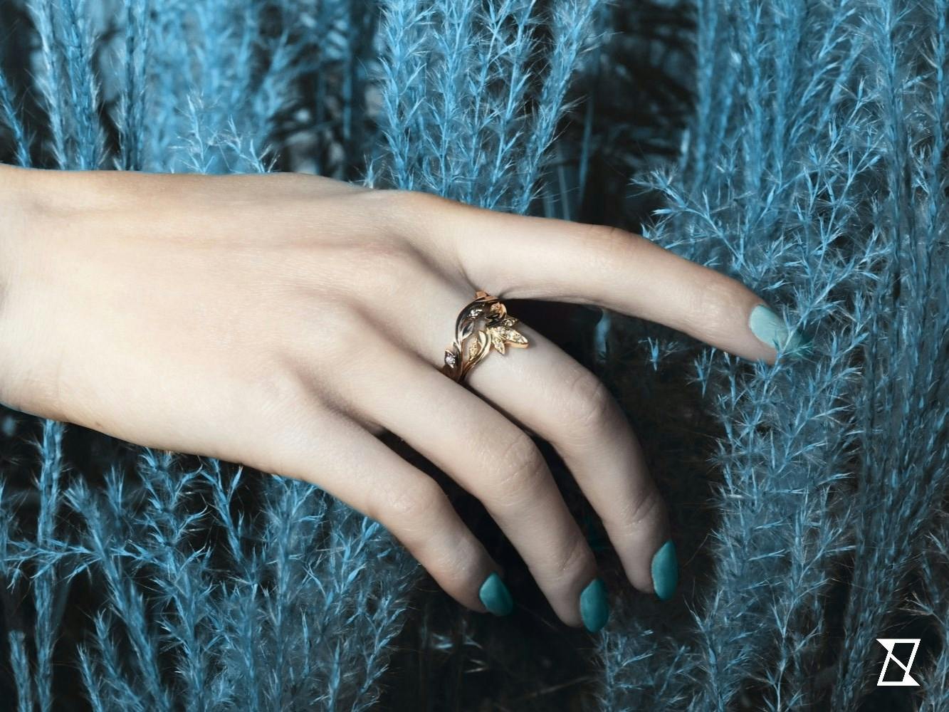 Two floral rings on a finger.
