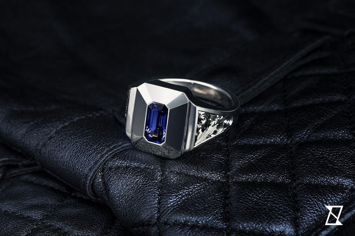 Floral, palladium gold signet fing with rectangular sapphire. 