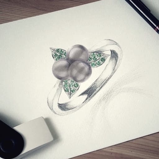 Ring with blueberry pearls and tsavorite.