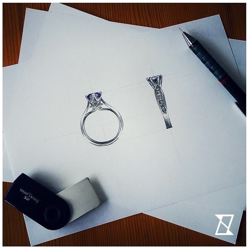 Individual concept sketch of a crown engagement ring with sapphire.