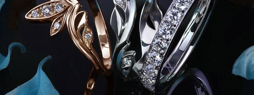 A set of women's wedding rings set with diamonds