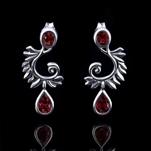 Earrings with rubies in the shape of wings.