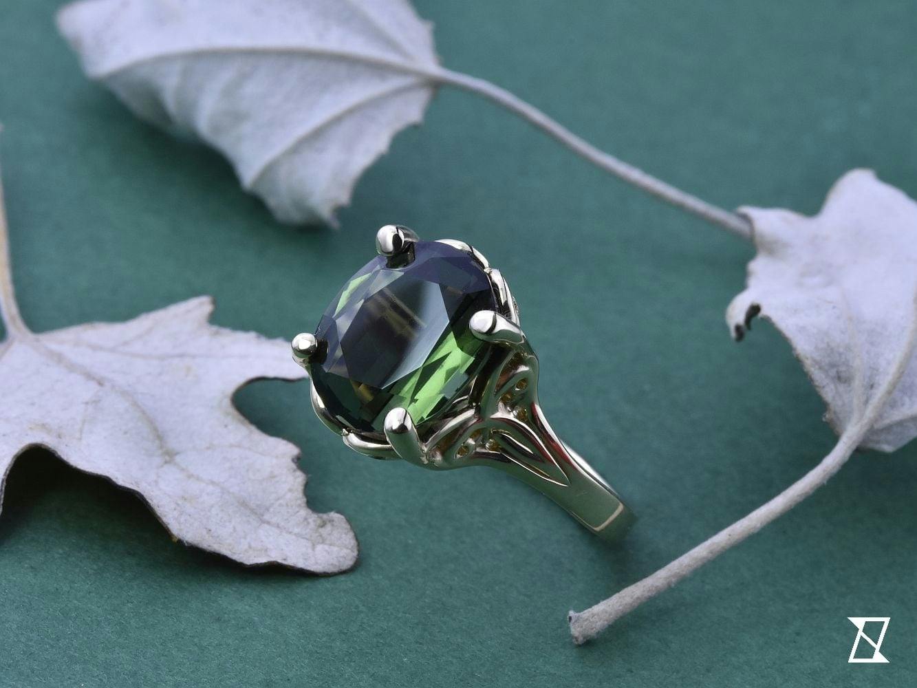 Art Deco ring with a green, custom cut, 5 ct tourmaline. 