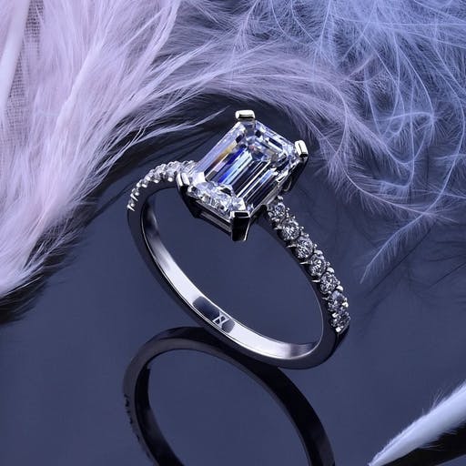 A ring with an emerald cut diamond.