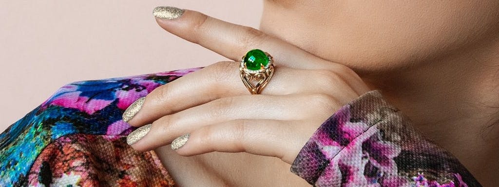 A large ring with an emerald.