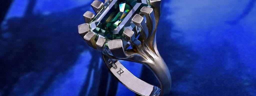 Kelp forest ring with moissanite in green gold.