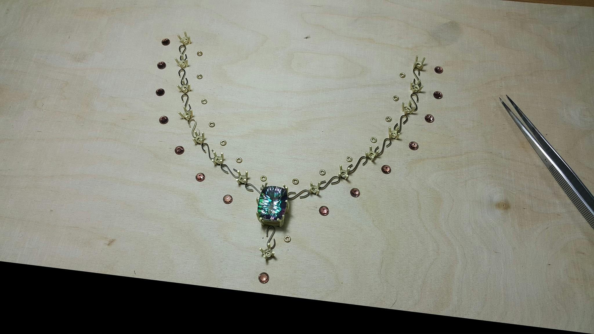 Gemstones and links of a necklace before the final assembly,