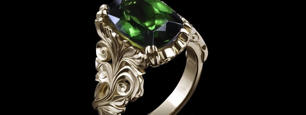 Кольцо с растительными мотивами с зеленым турмалином.