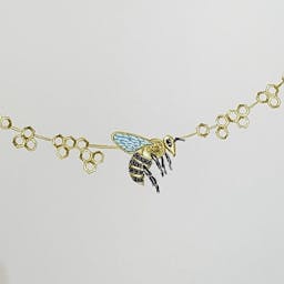 Necklace with a bee on a honeycomb