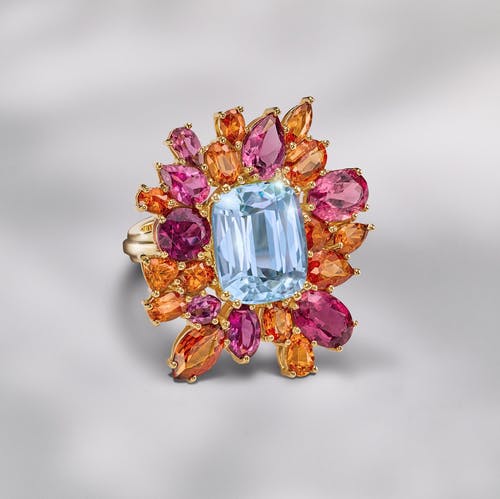 Family ring with aquamarine, tourmaline and garnet