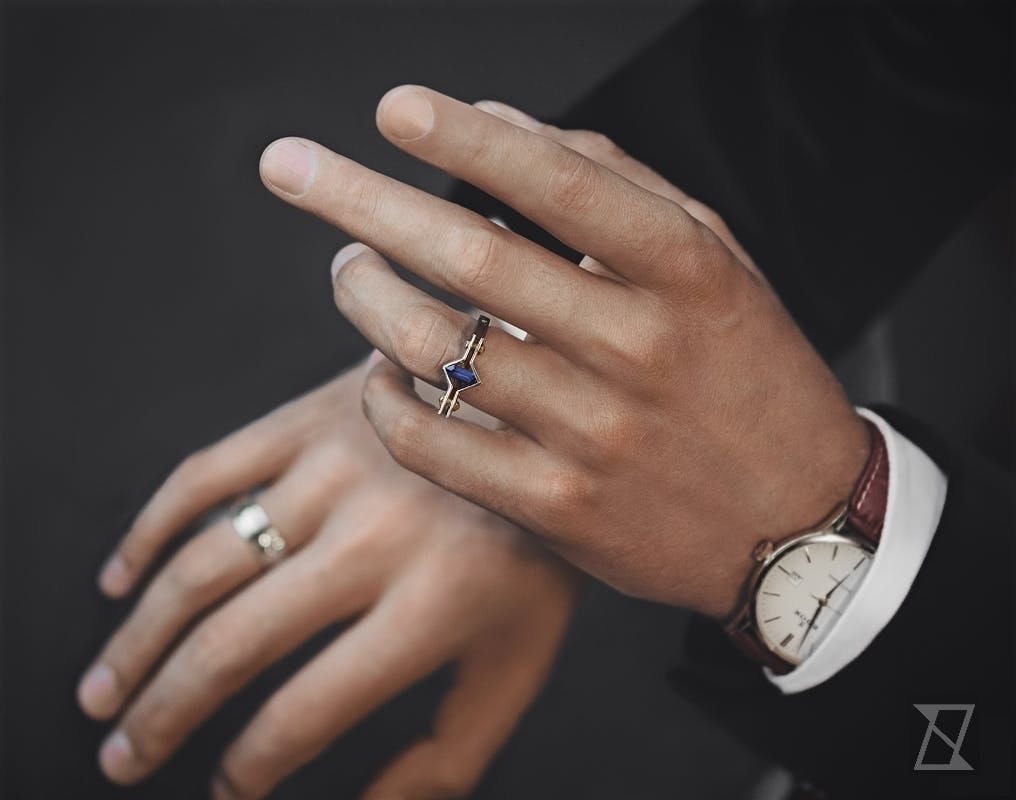 Astronomic ring on a gentleman's hand. 