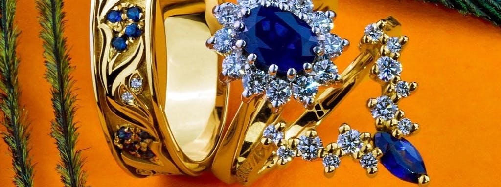 Yellow gold rings with sapphires and diamonds, matched to the ring.