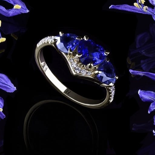 Ring with three heart-shaped sapphires