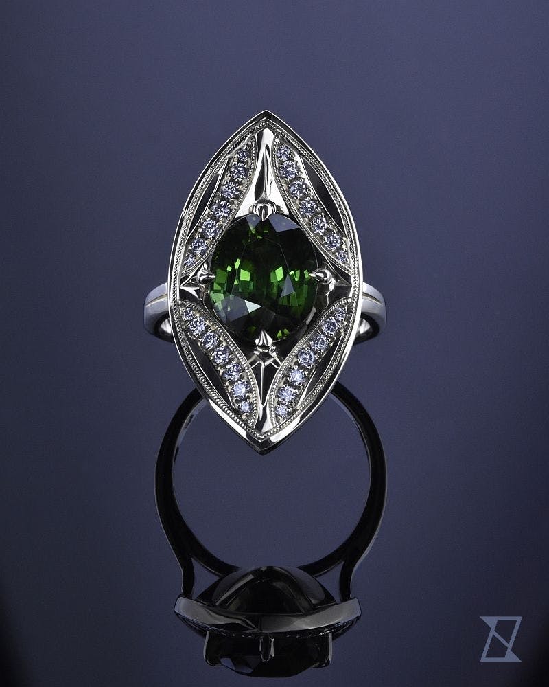 Marquise ring with green tourmaline and diamonds in green gold.