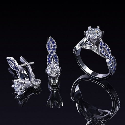 A set of jewelery with diamonds and sapphires