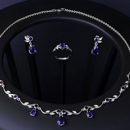 Jewelery set with Bolivian amethyst and diamonds in white gold.