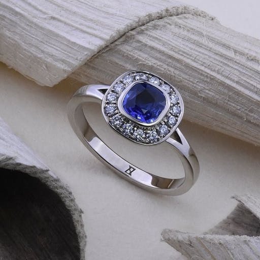 A cushion cut sapphire ring.