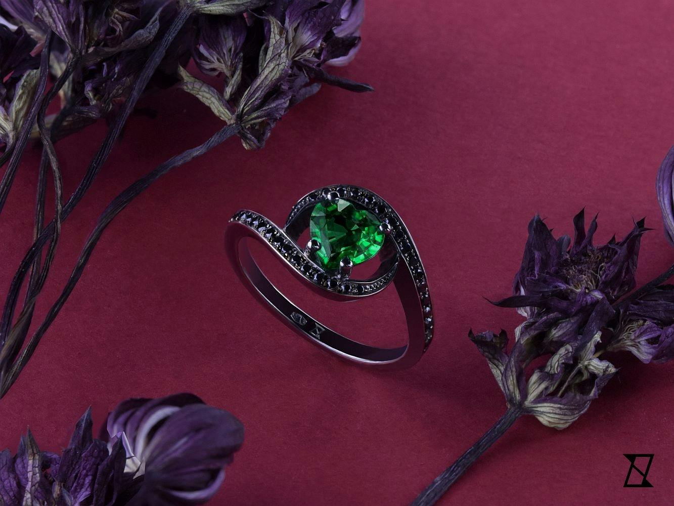 Finished ring with heart cut emerald and black diamonds in 14k black gold.