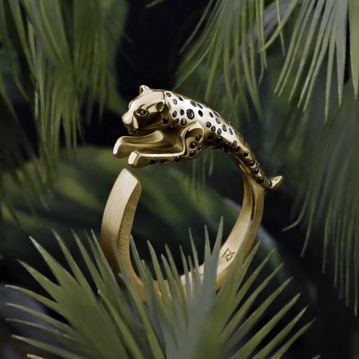 Black diamond-studded jumping jaguar ring.