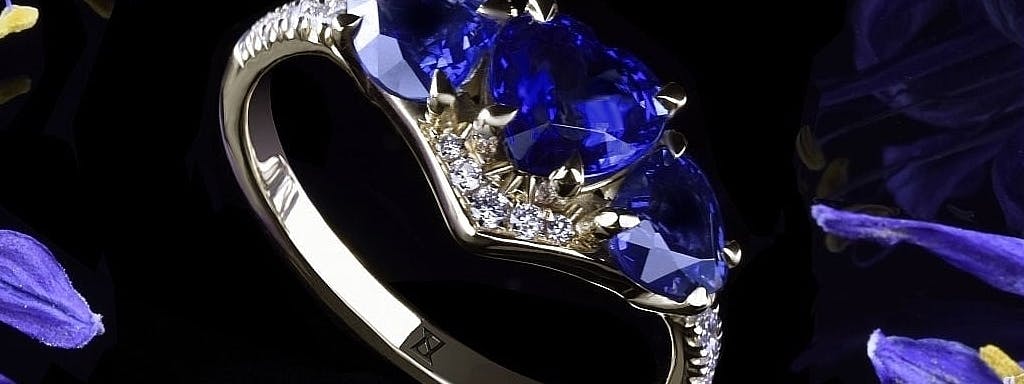 Ring with three heart-shaped sapphires