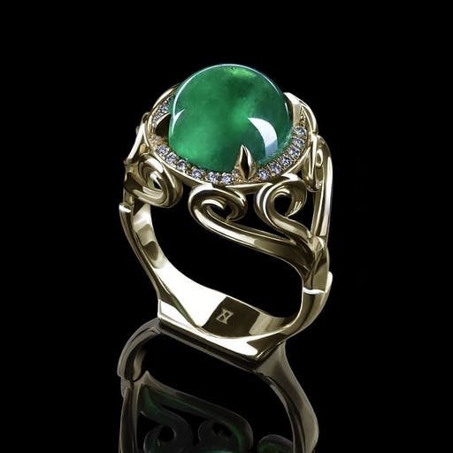 Ring with an emerald sphere with diamonds in yellow gold.