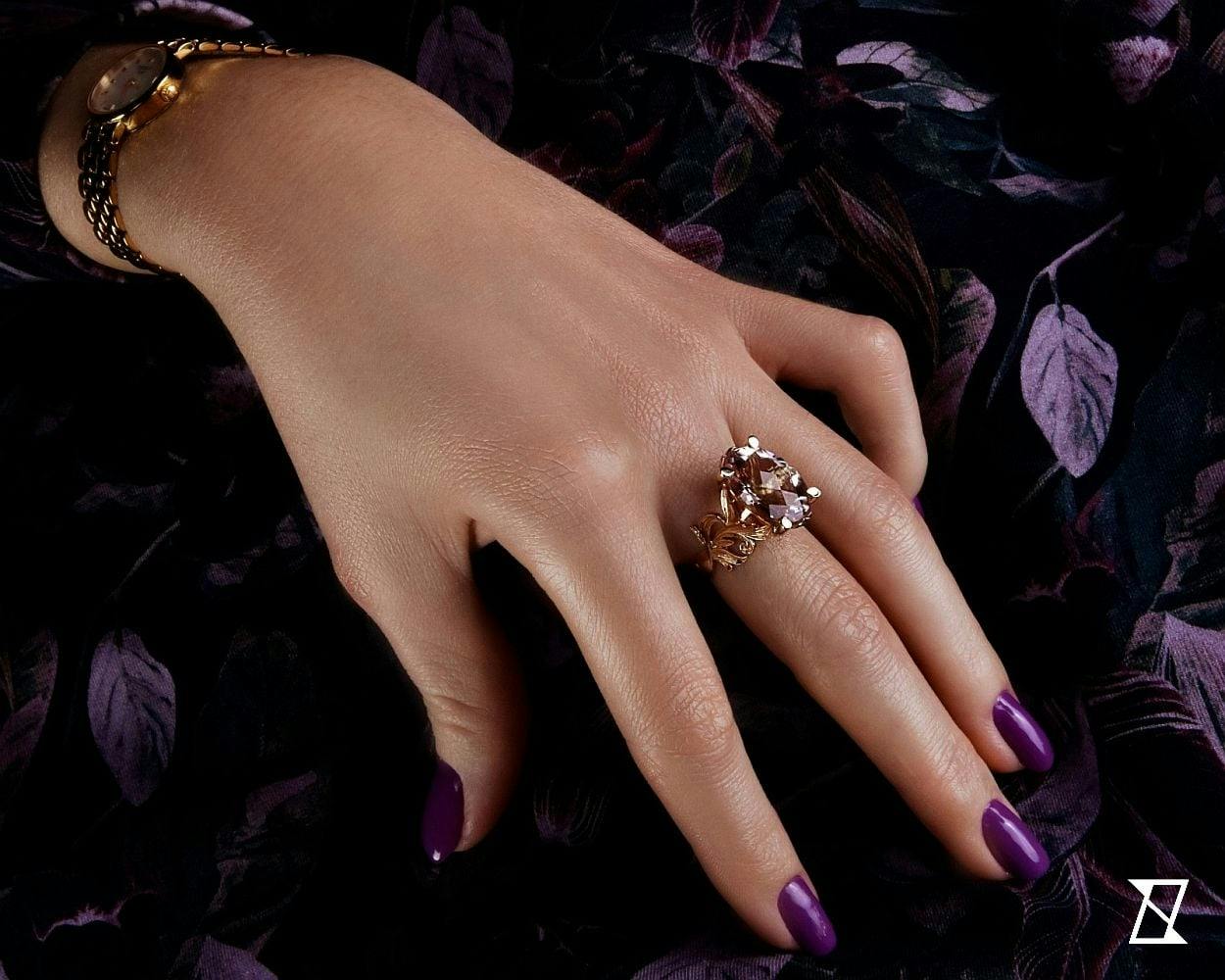 Morganite ring on a hand of a model.