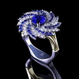 Galaxy ring with sapphire and diamonds.