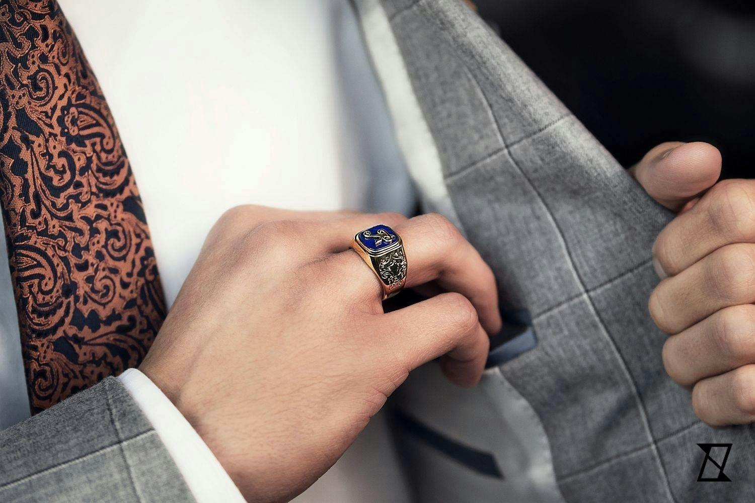 Lapis lazuli signet ring on the hand of a businessman.