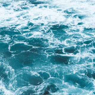 Square image of the ocean tinted teal