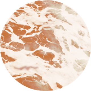 Circle image of the ocean with an orange coloured filter over the top