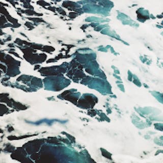 Square image of the ocean tinted teal