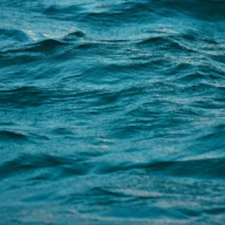 Square image of the ocean tinted teal