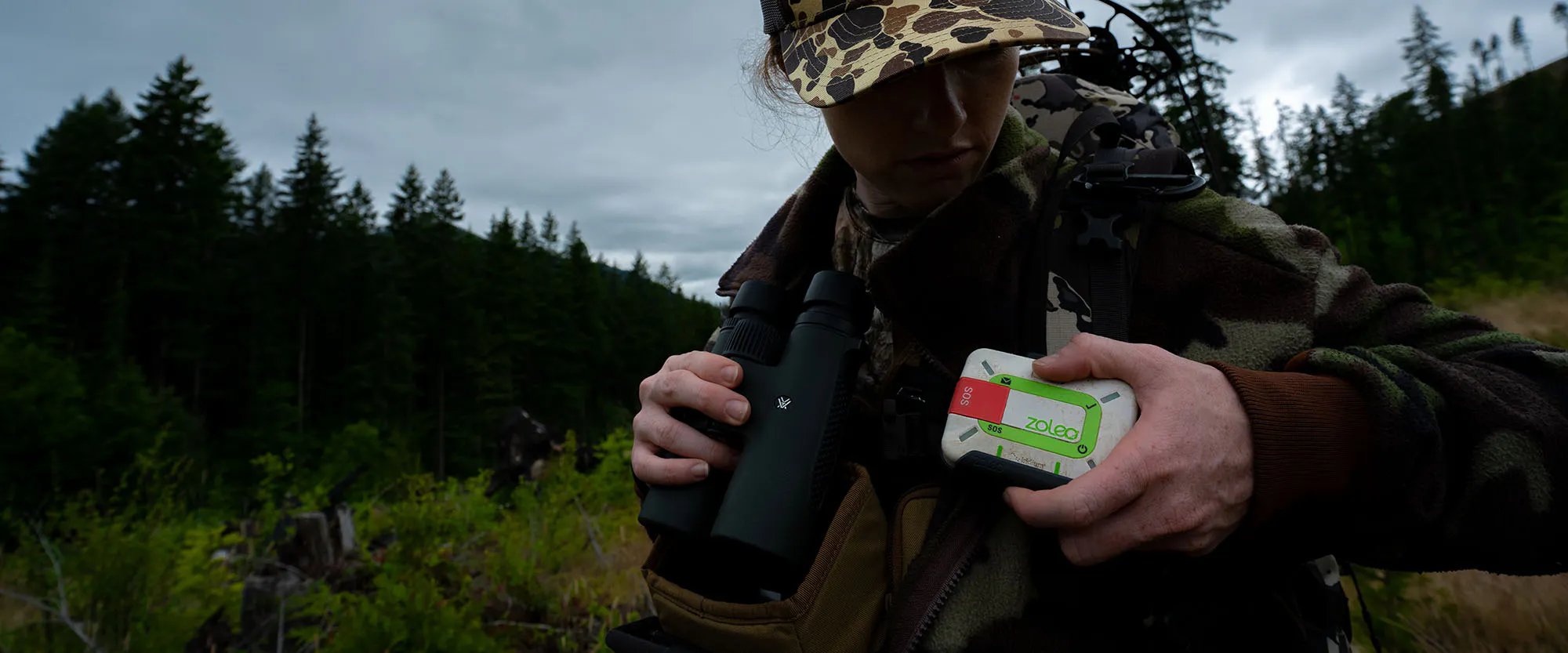 woman hunting with a ZOLEO 1.5 satellite communicator device