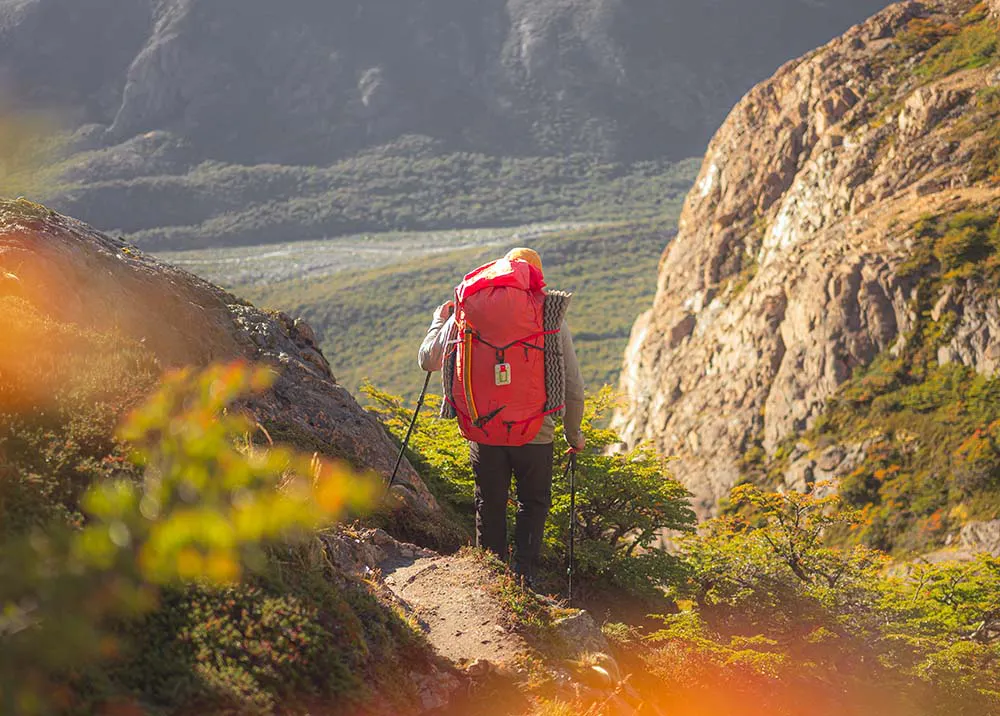 hiker with a backpack and ZOLEO