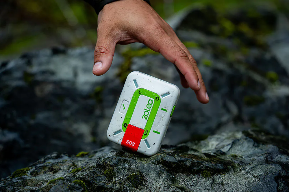 extra durable ZOLEO 1500 device falling out of hikers hand