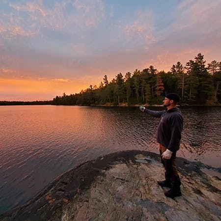 Matt at sunset, with ZOLEO