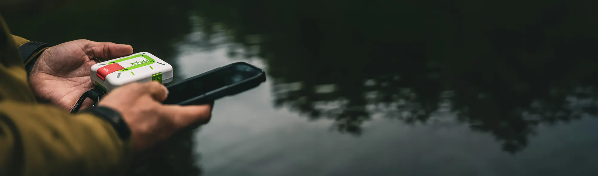 a hunter using a ZOLEO device with the mobile app