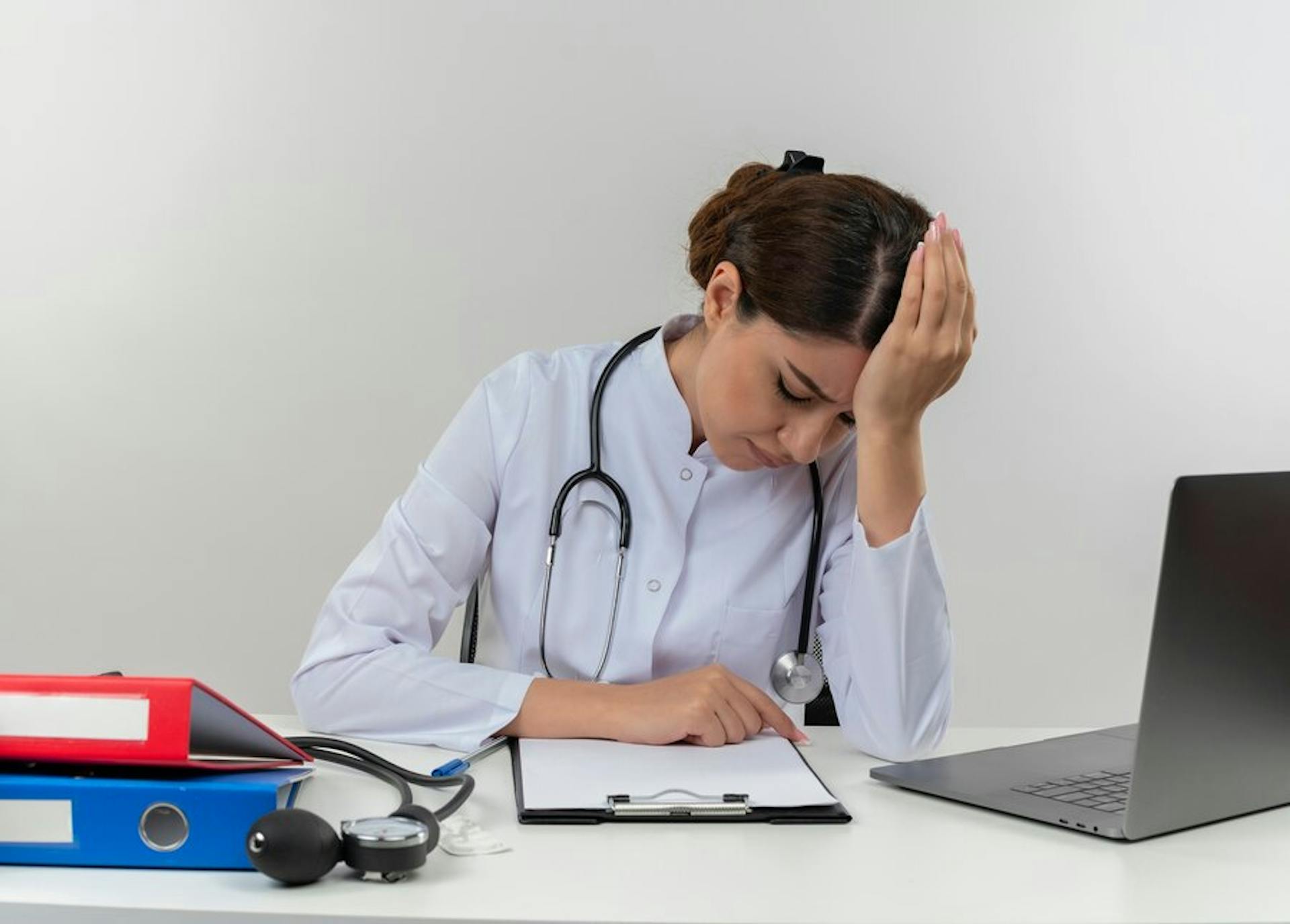 tired-young-female-doctor-wearing-medical-robe