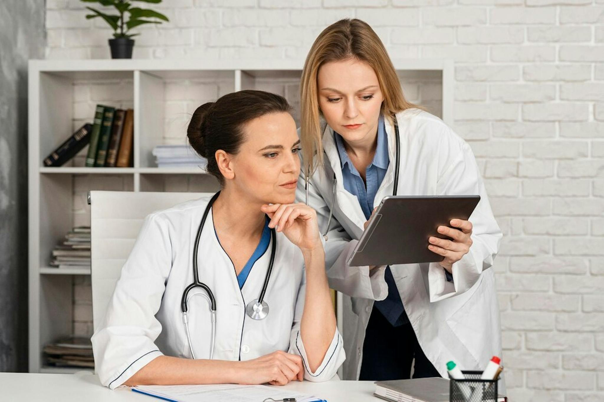 female doctors going through patient records